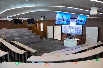 A room with a few monitors

Description automatically generated with medium confidence